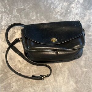 Vintage Coach. She was well loved but could be brought back to life.
